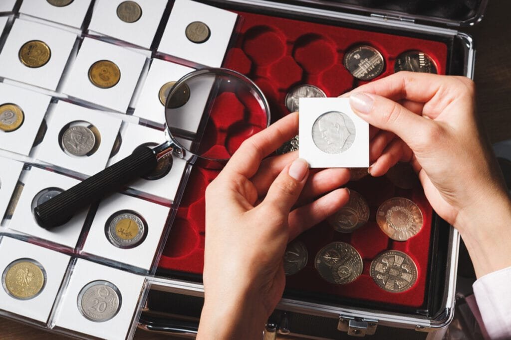 A collector studying a coin