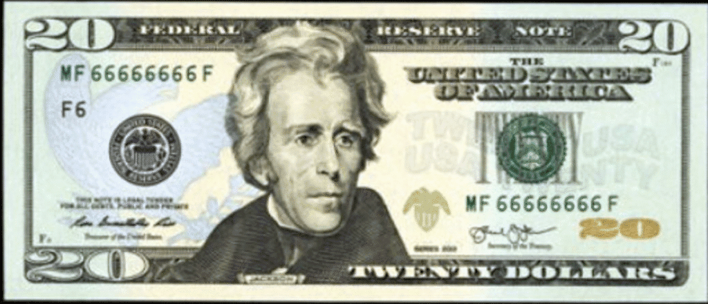 US $20 bill with a solid number serial